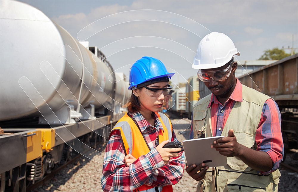 Industrial worker in safety gear operating machinery, illustrating DORN's proactive EHS compliance approach
